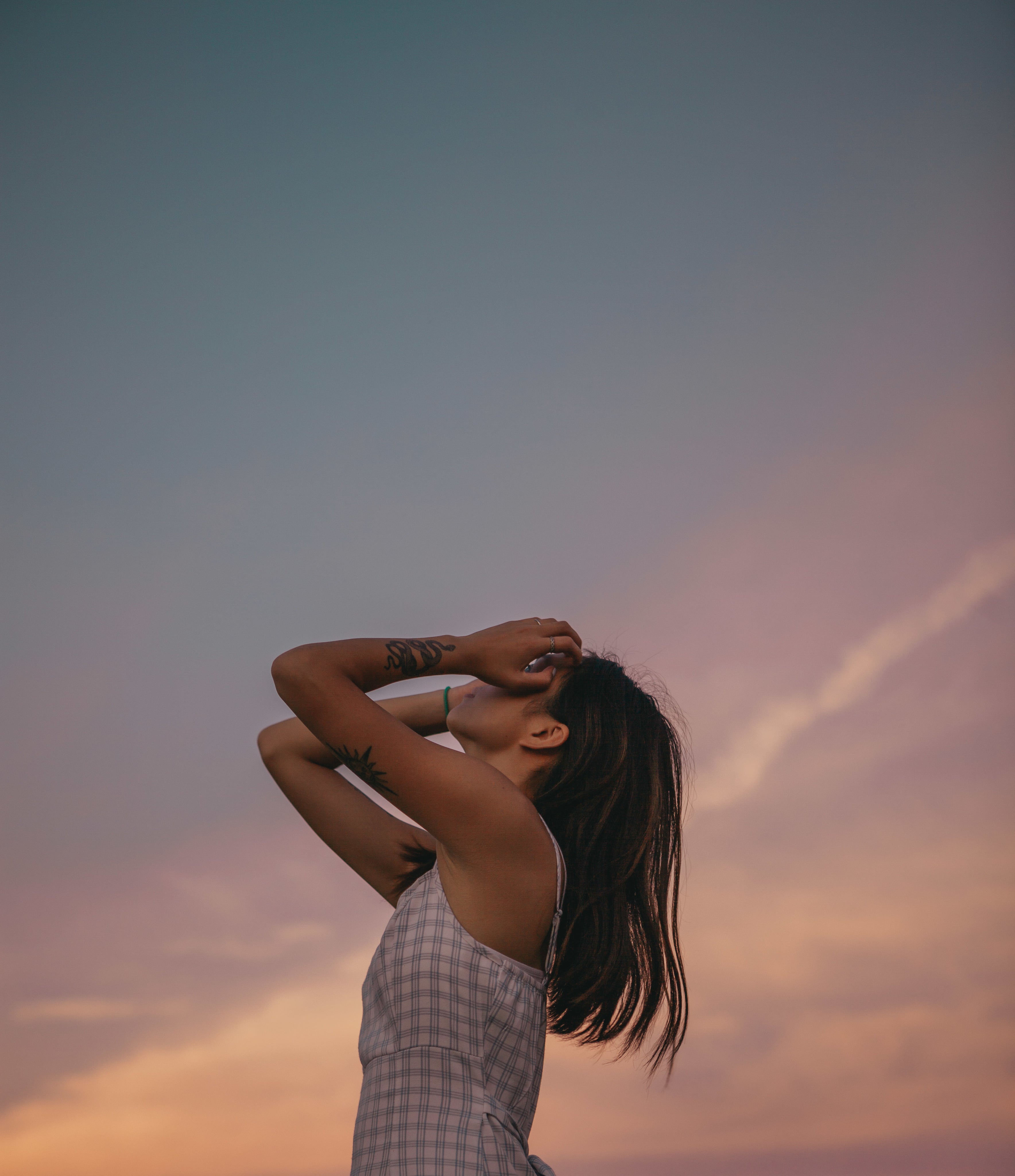 tattooed-person-posing-at-sunset.jpg